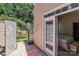Cozy patio leads to a serene bedroom with a private backyard, creating a peaceful retreat at 5305 Waverly Lynn Ln # 4A, Charlotte, NC 28269