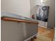 Staircase featuring wooden handrail, carpeted steps, and a modern wall art at 5305 Waverly Lynn Ln # 4A, Charlotte, NC 28269