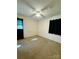 Bedroom with neutral carpet, ceiling fan, and dark curtains at 5420 Harkey Rd, Waxhaw, NC 28173