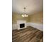 Cozy dining room featuring a classic white fireplace and stylish flooring at 5420 Harkey Rd, Waxhaw, NC 28173