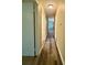 Hallway with wood-look flooring and white trim at 5420 Harkey Rd, Waxhaw, NC 28173