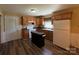 Well-equipped kitchen with wood cabinets, modern appliances, and a functional kitchen island at 5420 Harkey Rd, Waxhaw, NC 28173