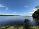 Serene lake view showcases calming waters and surrounding tree line at 5420 Harkey Rd, Waxhaw, NC 28173