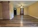 Inviting living room featuring stylish wood floors and a decorative sliding barn door at 5420 Harkey Rd, Waxhaw, NC 28173