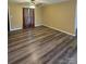 Bright living room with a ceiling fan, stylish curtains, and modern flooring at 5420 Harkey Rd, Waxhaw, NC 28173