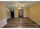 Bright living room with a ceiling fan, stylish curtains, and modern flooring at 5420 Harkey Rd, Waxhaw, NC 28173