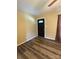 Living room with a black front door, stylish curtains, and modern flooring at 5420 Harkey Rd, Waxhaw, NC 28173