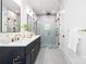 Modern bathroom with double vanity, marble shower, and stylish fixtures at 550 W Cama St, Charlotte, NC 28217