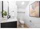 Modern half-bathroom with sleek black fixtures, white walls, and stylish decor at 550 W Cama St, Charlotte, NC 28217