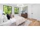 Bright, airy bedroom with large windows, modern lighting, and neutral decor at 550 W Cama St, Charlotte, NC 28217