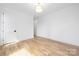 Bright bedroom featuring hardwood floors and a large window at 550 W Cama St, Charlotte, NC 28217
