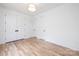 Spacious bedroom with beautiful hardwood floors and crisp white trim and doors at 550 W Cama St, Charlotte, NC 28217