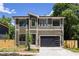 Beautiful two-story home with modern design elements and a two-car garage at 550 W Cama St, Charlotte, NC 28217