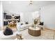 Open-concept living room with stylish furnishings and seamless flow to the kitchen and staircase at 550 W Cama St, Charlotte, NC 28217