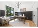Bright and airy home office featuring stylish decor and a large window at 550 W Cama St, Charlotte, NC 28217