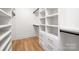 Spacious walk-in closet with custom shelving and drawers for ample storage at 550 W Cama St, Charlotte, NC 28217