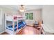 Bright bedroom with bunkbeds, ceiling fan and an abundance of natural light at 6350 Mount Pleasant S Rd, Concord, NC 28025