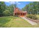 Exterior view of a charming home featuring a well-kept lawn and inviting curb appeal at 6350 Mount Pleasant S Rd, Concord, NC 28025
