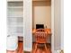 Small home office nook off a bedroom with desk, chair and shelving at 6350 Mount Pleasant S Rd, Concord, NC 28025