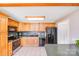 A functional kitchen offers ample cabinets, tile flooring, and neutral countertops at 6350 Mount Pleasant S Rd, Concord, NC 28025