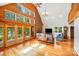 Inviting living room boasts soaring ceilings, a brick fireplace, and large windows offering natural light at 6350 Mount Pleasant S Rd, Concord, NC 28025