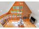 Aerial view of bright, open living room with cathedral ceiling, fireplace, and hardwood floors at 6350 Mount Pleasant S Rd, Concord, NC 28025