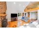 Cozy living room with a brick fireplace, loft, and comfortable seating at 6350 Mount Pleasant S Rd, Concord, NC 28025