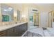 Elegant bathroom with double sinks, quartz countertops, and a separate shower and tub at 6722 Elmstone Dr, Charlotte, NC 28277