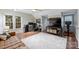 Bedroom with hardwood floors, a fan, and two desks, offering space for work and relaxation at 6722 Elmstone Dr, Charlotte, NC 28277