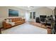 Bedroom with hardwood floors, a brown couch and large area rug at 6722 Elmstone Dr, Charlotte, NC 28277