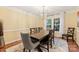 Formal dining room featuring a large wooden table, elegant chairs, and modern chandelier at 6722 Elmstone Dr, Charlotte, NC 28277