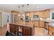 Spacious kitchen featuring a center island, stainless steel appliances, and wood cabinetry at 6722 Elmstone Dr, Charlotte, NC 28277