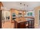 Well-equipped kitchen with a large island, stainless steel appliances, and hardwood floors at 6722 Elmstone Dr, Charlotte, NC 28277