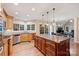 Open-concept kitchen with a large island, stainless steel appliances, and hardwood floors at 6722 Elmstone Dr, Charlotte, NC 28277