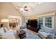 Open living room flows into a kitchen, with a vaulted ceiling and large windows at 6722 Elmstone Dr, Charlotte, NC 28277