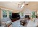 Cozy living room with a fireplace, vaulted ceiling, and ample natural light at 6722 Elmstone Dr, Charlotte, NC 28277