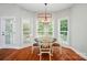 Bright breakfast nook with large windows and a charming chandelier at 7006 Nesbit Rd, Waxhaw, NC 28173