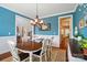 Dining room with hardwood floors, and an open doorway to a kitchen at 7006 Nesbit Rd, Waxhaw, NC 28173
