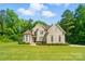 Beautiful two-story home features a brick facade, mature trees, and a well-maintained lawn at 7006 Nesbit Rd, Waxhaw, NC 28173