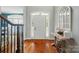 Bright foyer with hardwood floors, white trim, and elegant decor at 7006 Nesbit Rd, Waxhaw, NC 28173