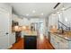 Modern kitchen featuring white cabinets, stainless steel appliances, and granite countertops at 7006 Nesbit Rd, Waxhaw, NC 28173
