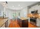 Well-lit kitchen with stainless steel appliances, a center island and an adjacent breakfast nook at 7006 Nesbit Rd, Waxhaw, NC 28173