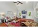 Cozy living room featuring vaulted ceilings, a fireplace, and hardwood floors at 7006 Nesbit Rd, Waxhaw, NC 28173