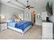 Airy main bedroom with a ceiling fan and walk-in closet access at 7006 Nesbit Rd, Waxhaw, NC 28173