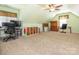 Spacious and versatile attic space, perfect for a playroom or extra storage, featuring a ceiling fan at 725 Old State Sw St, Concord, NC 28027