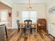 Cozy dining area with hardwood floors, crown molding, and a rustic-style light fixture, creating a warm atmosphere at 725 Old State Sw St, Concord, NC 28027
