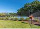 Well-maintained community tennis courts surrounded by lush landscaping and greenery on a sunny day at 725 Old State Sw St, Concord, NC 28027