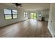 Inviting living space with light wood floors, sleek black windows, and sliding glass doors to the backyard at 760 3Rd Street Sw Pl, Hickory, NC 28602