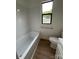 Modern bathroom featuring a bathtub and shower combination with stylish subway tile at 804 3Rd Street Sw Pl, Hickory, NC 28602