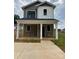 Charming two-story home with a covered front porch and a modern color scheme at 804 3Rd Street Sw Pl, Hickory, NC 28602